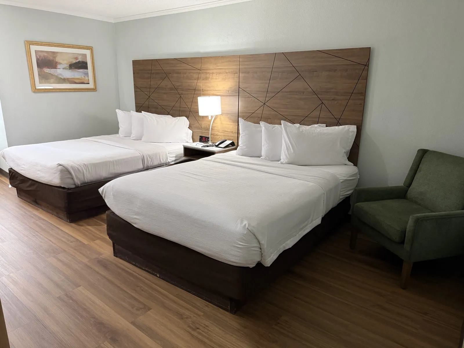 Guest room with two queen beds at Wingate by Wyndham Livonia